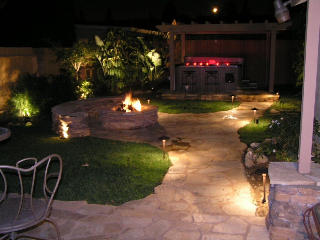 Evening patio with fire pit and lighting